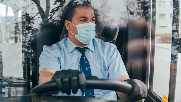 Coach driver wearing mask, Covid-19 social distancing, safe travel