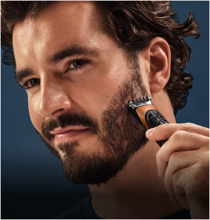 Beard care category tile showing a man trimming his beard with a Gillette trimmer.