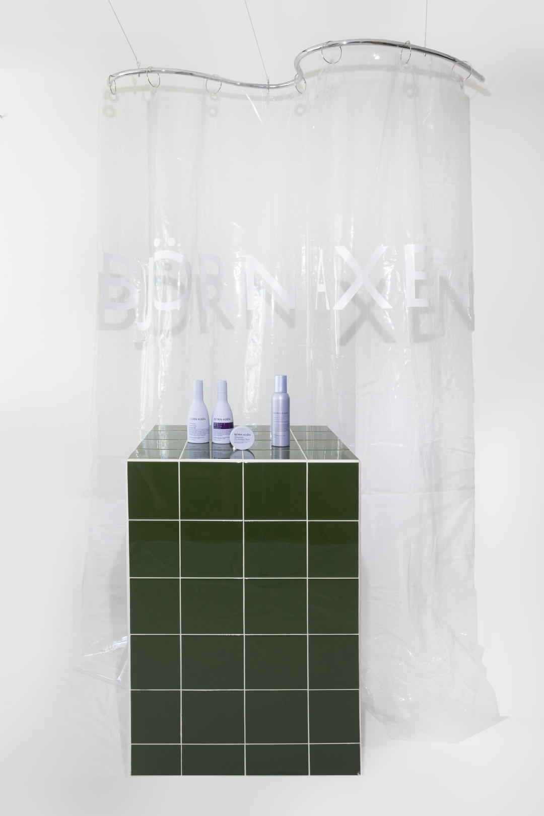 Björn Axén Volume campaign featuring a podium and wavy shower curtain