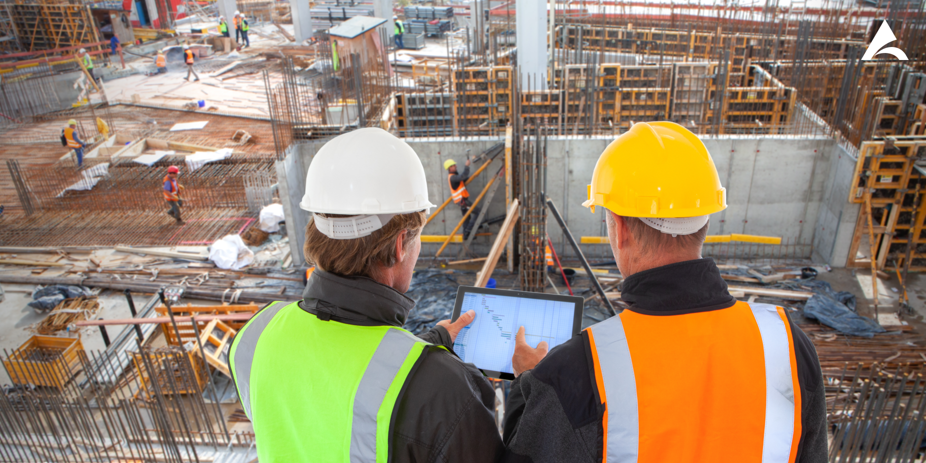 Two project managers overseeing a construction site