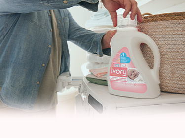 A man opening an Ivory Snow bottle