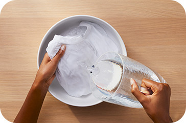 How to get breast milk stains out of clothing: soak in cold water