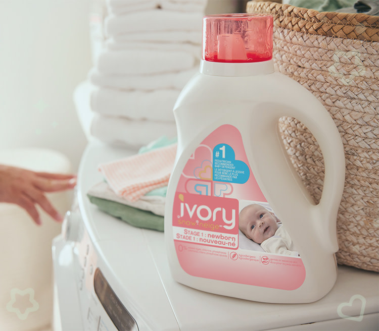 Ivory Snow  liquid detergent for getting food stains out of baby clothes on top of a washing machine