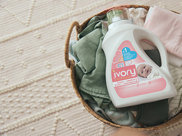 A basket with the newborn clothes washed with Ivory Snow