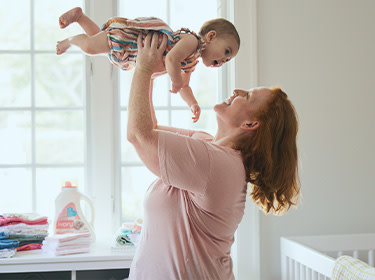 A mother playing with a baby