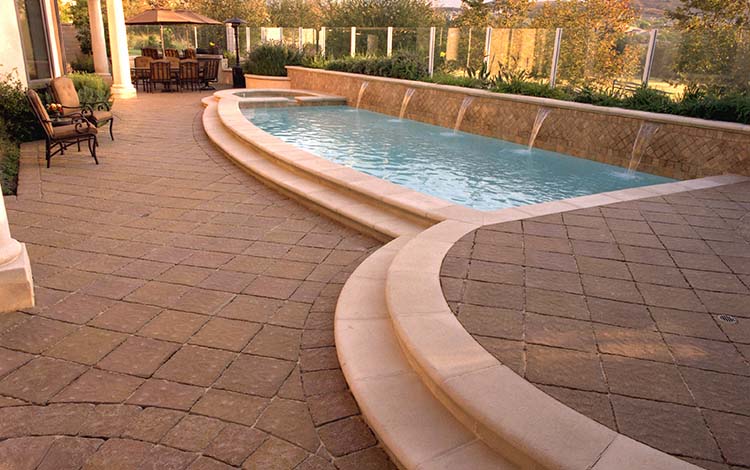 Paver pool deck, pool, water features, patio furniture, backyard, paving stones, steps, universal region, daytime