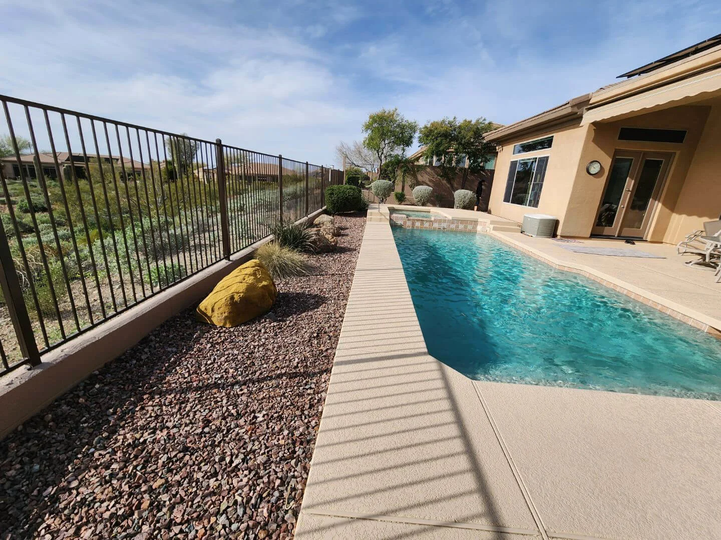 Before Pic of Phoenix Arizona Backyard with Pool and Gravel