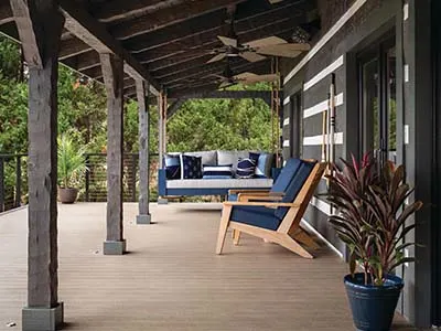 composite decking with pergola style deck awning and porch swing