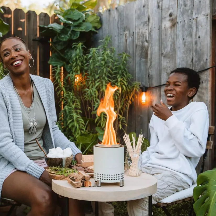 Solo Stove Mesa Tabletop Fire Pit with mom and son laughing outdoors