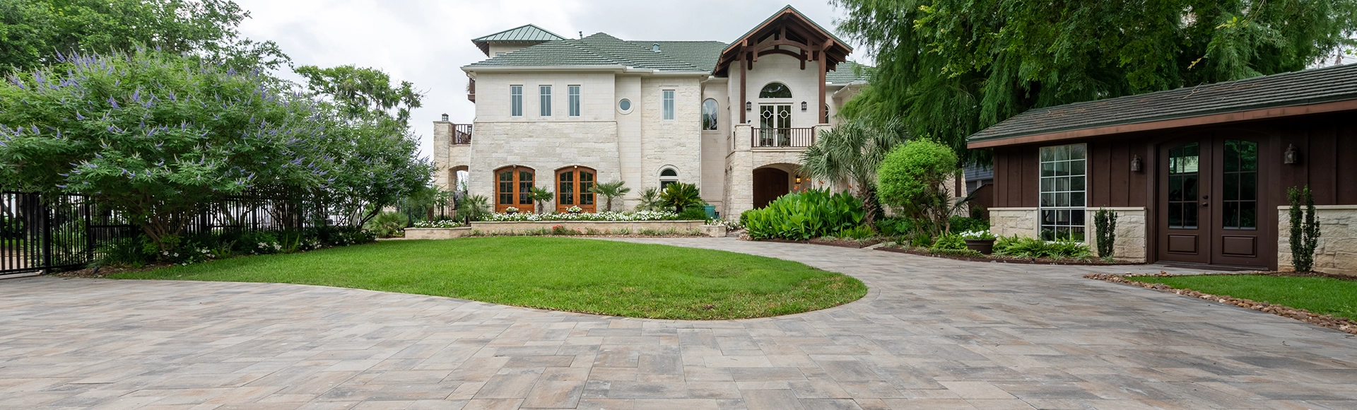 Large paving stone driveway in front of a Houston home. 