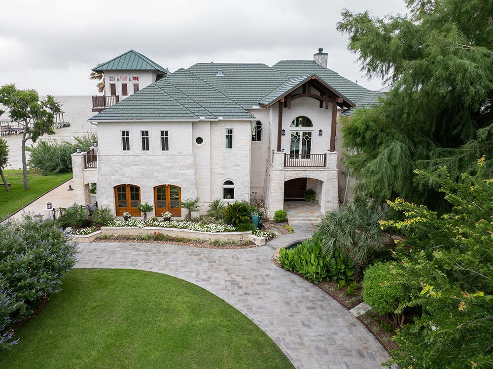 Large paving stone driveway in front a Texas home. 