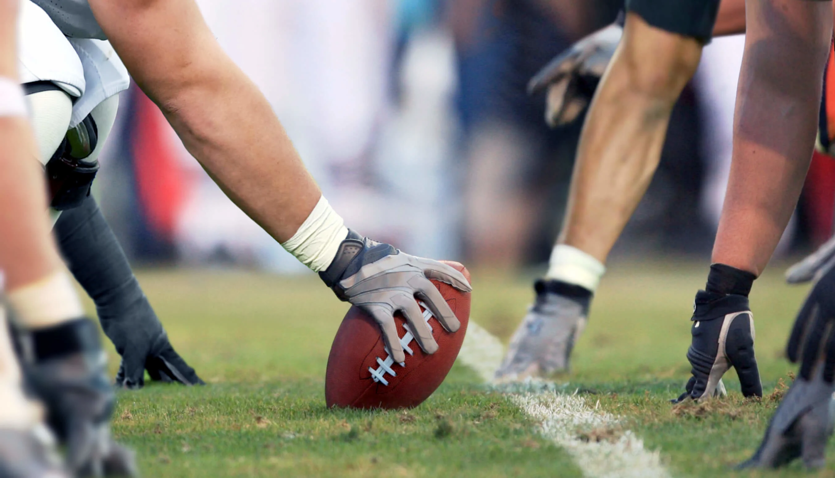 Seattle Seahawks football on turf field with players