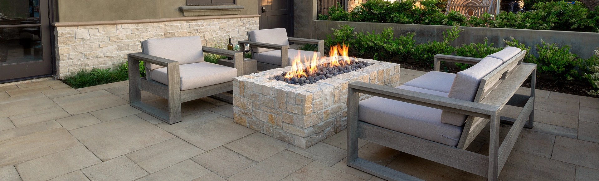 Outdoor paving stone walkway with turf and paving stone fire pit. 