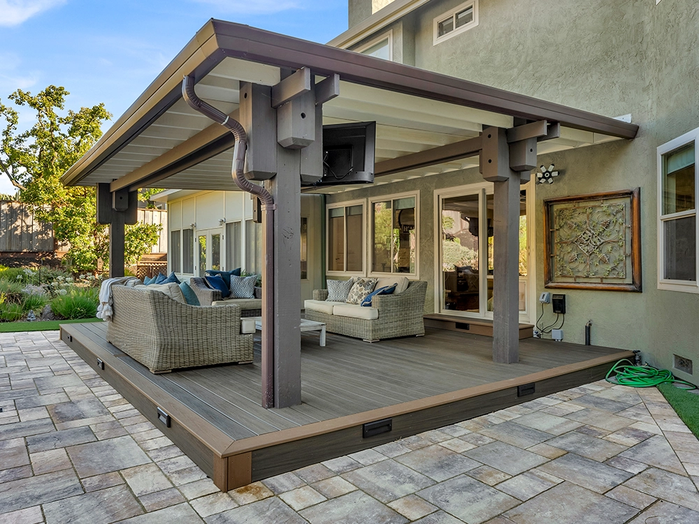 Lovely pergola on a composite deck and paver patio. 