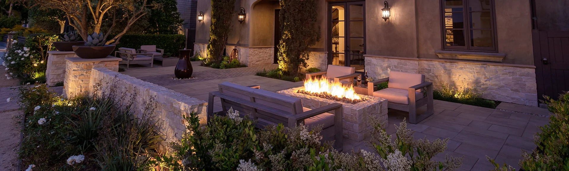 Patio with paver fire pit and night. 