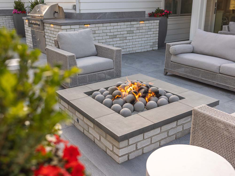 Stone fire pit, paver patio, built-in grill