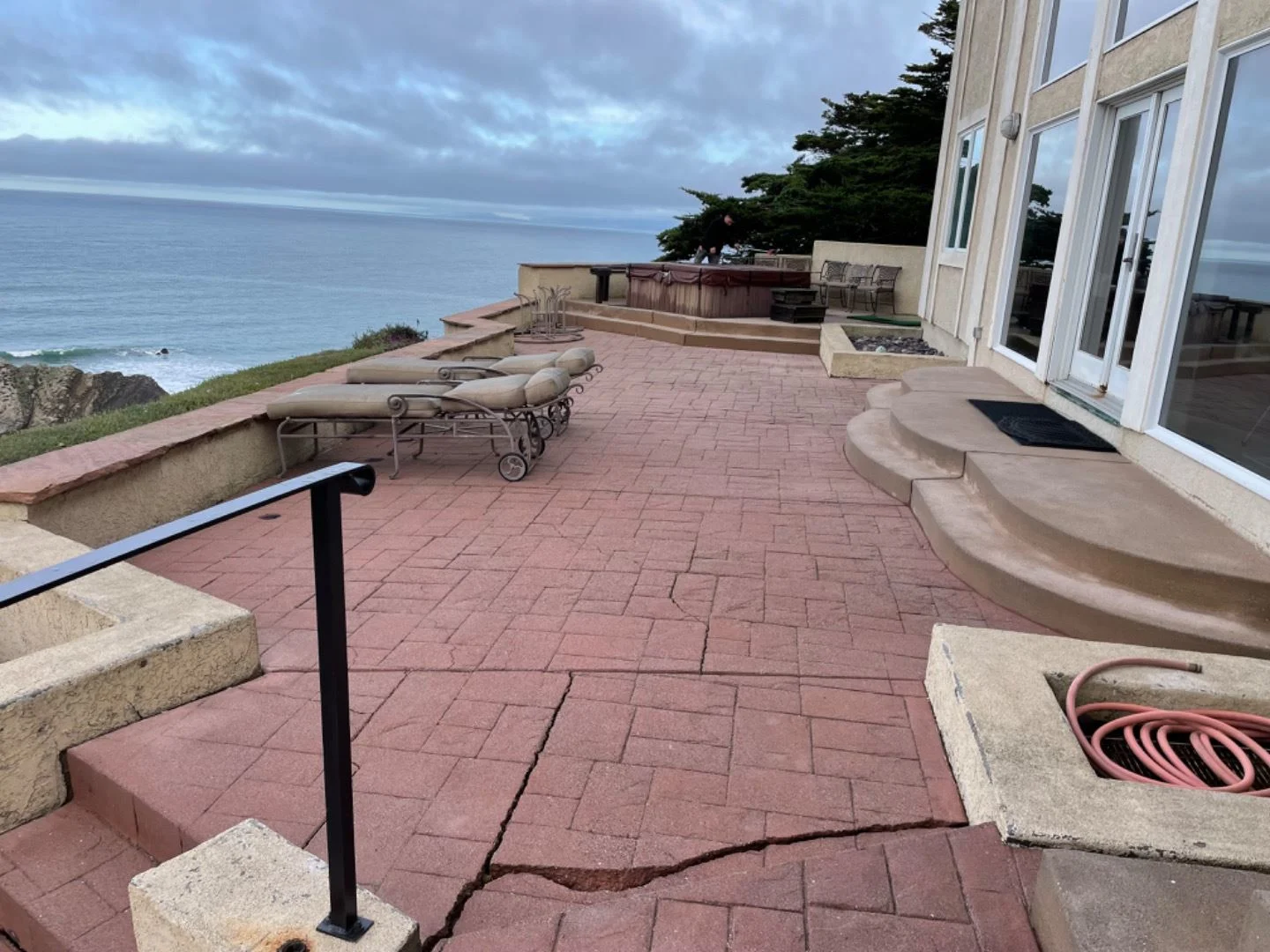 Cracked crumbling brick patio in coastal California backyard before pic