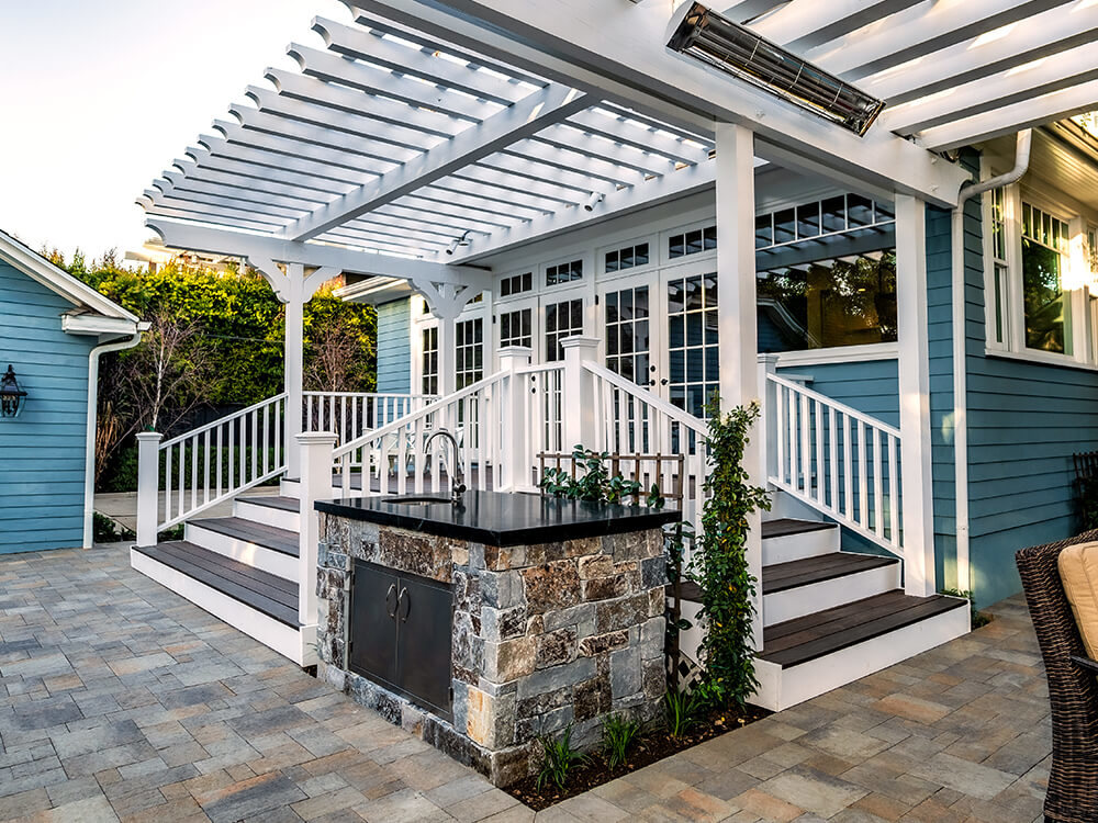 paver patio, pergola, decking and outdoor kitchen and sink storage