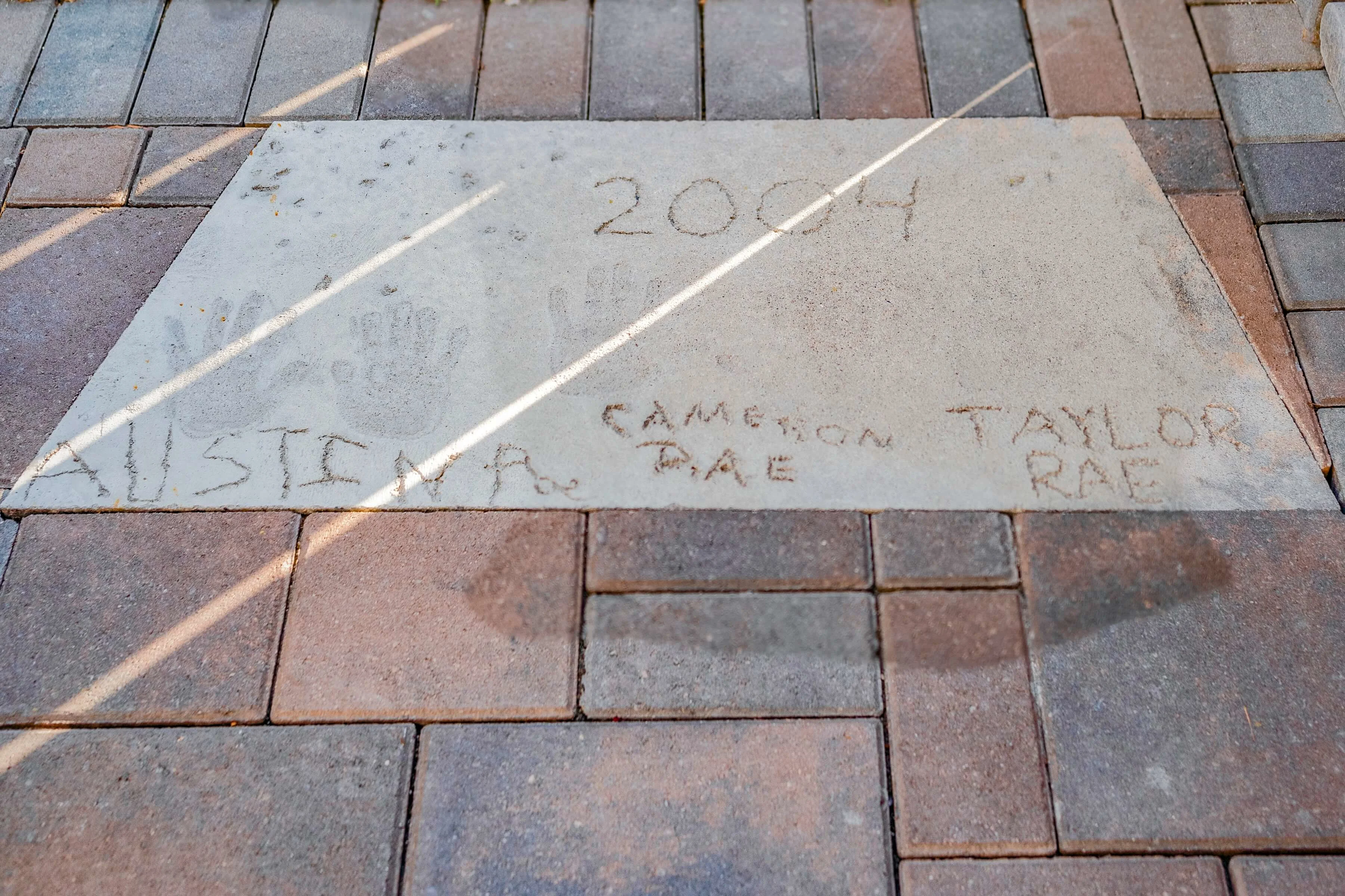 Keepsake handprints in poured concrete from old patio