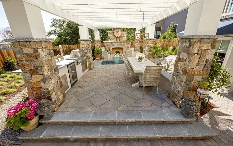 Patio, paver patio, outdoor kitchen, countertops, outdoor fireplace, pergola, pillars, outdoor entertainment, living space, paving stones, patio furniture, dining, total outdoor transformation, universal region, daytime