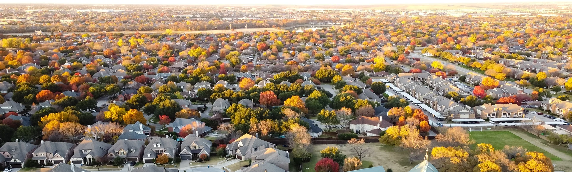 Aerial view new suburban houses neighborhood with church and master planned community in Coppell, Texas, USA