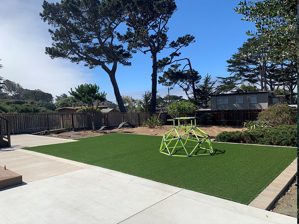 Turf lawn insert with jungle gym in California