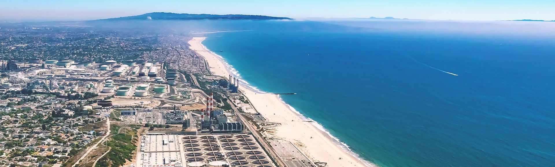 Aerial view of an oil refinery on the beach of El Segundo, Los Angeles, CA