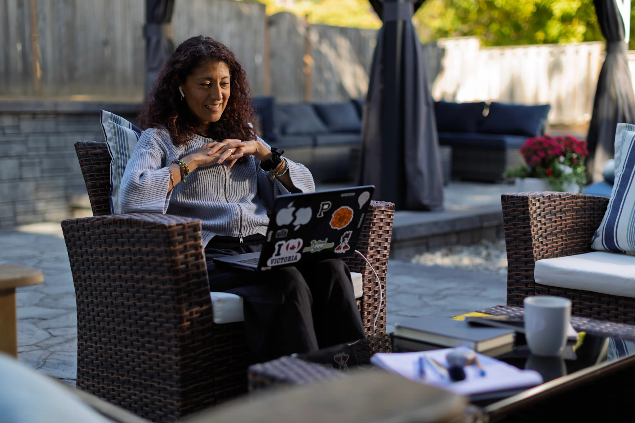 Woman working from home outdoors on her computer