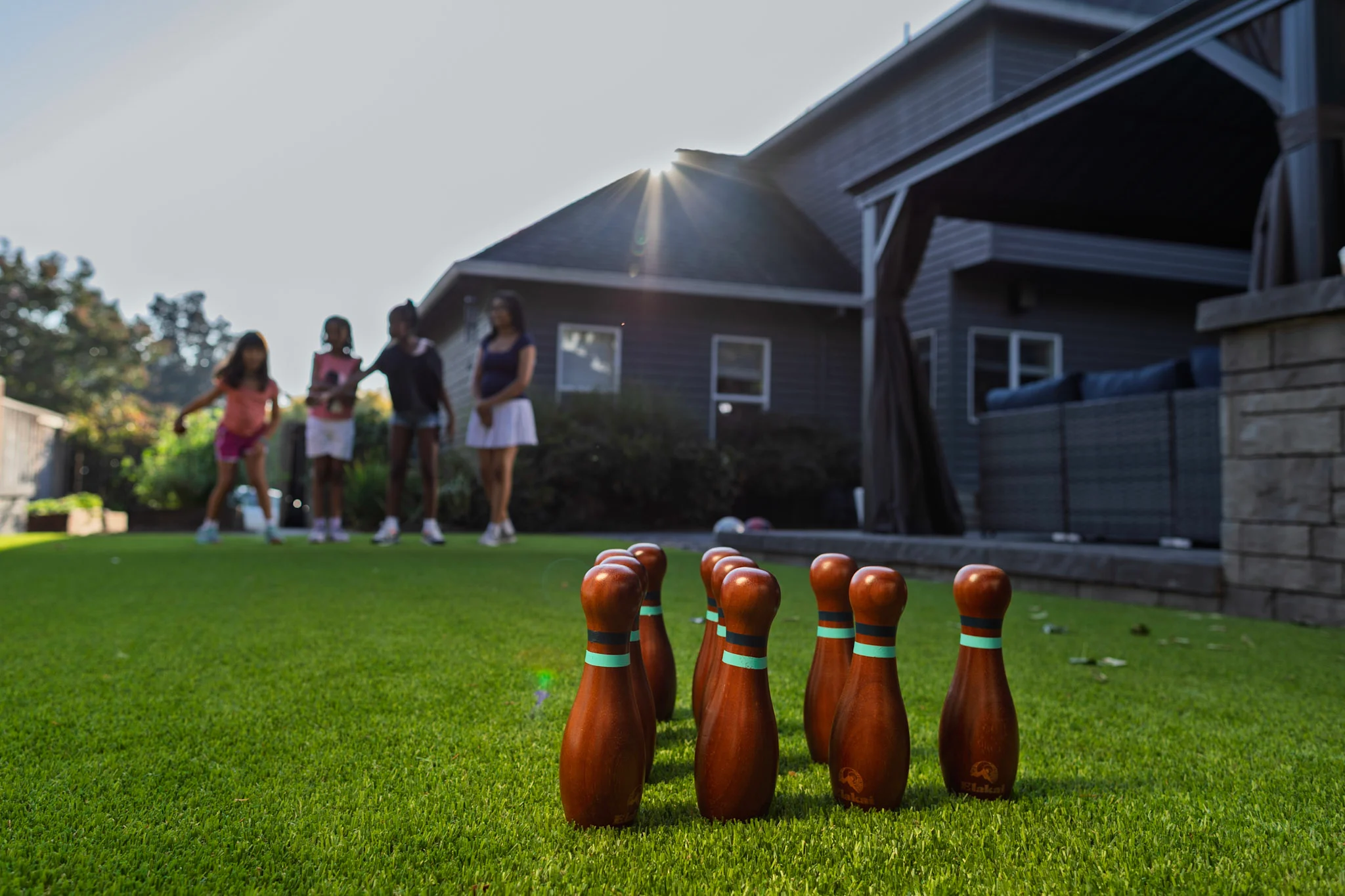 Kids and lawn bowling on a turf lawn