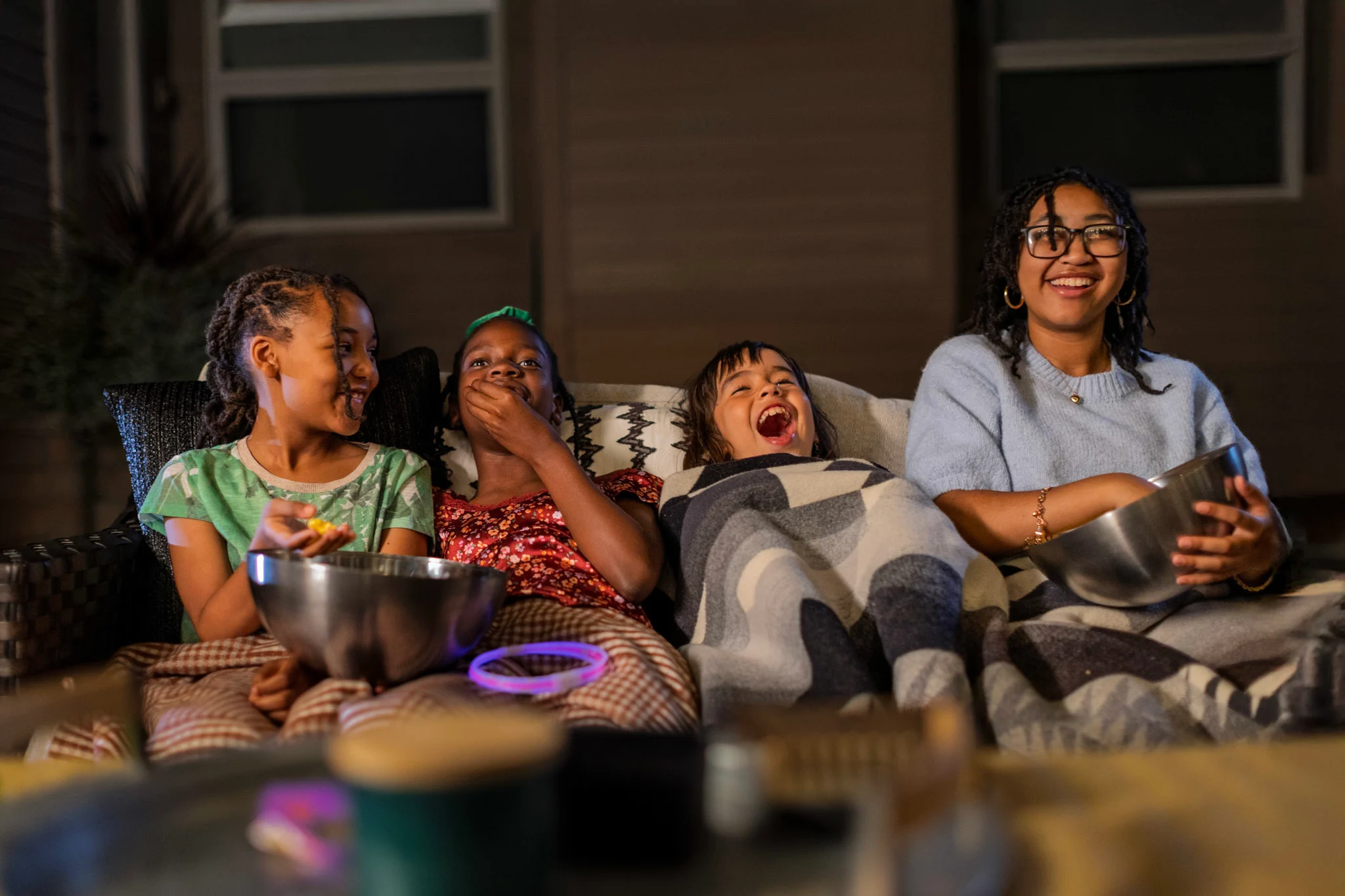Kids enjoying outdoor movie on the patio