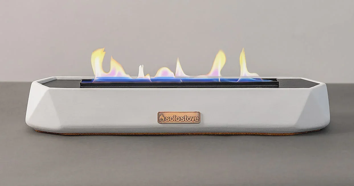 Solo Stove Runner Tabletop Fire Pit in white with flames