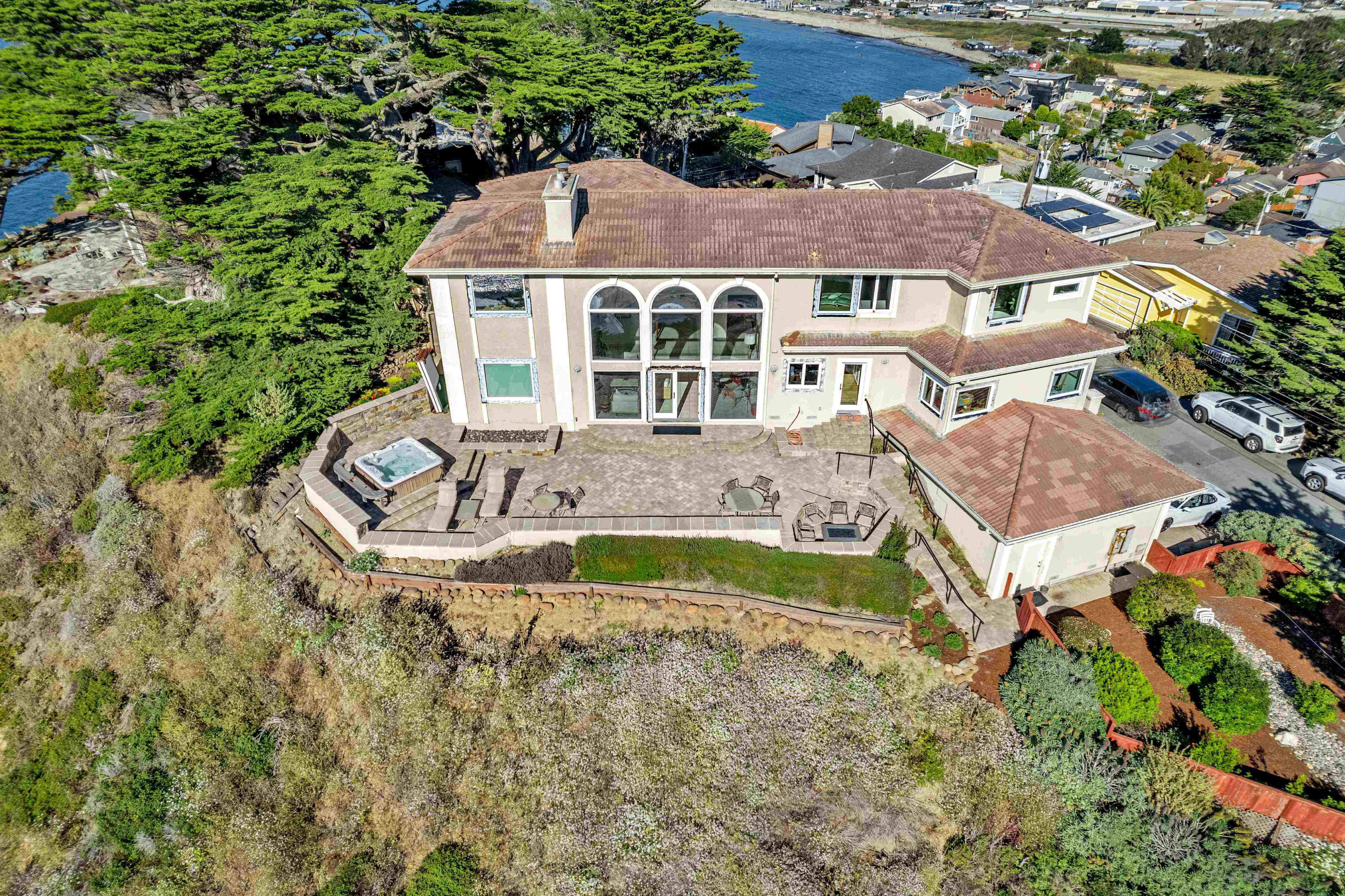 Coastal Home Arial View of Paving Stone Courtyard Set On Cliff in Northern California