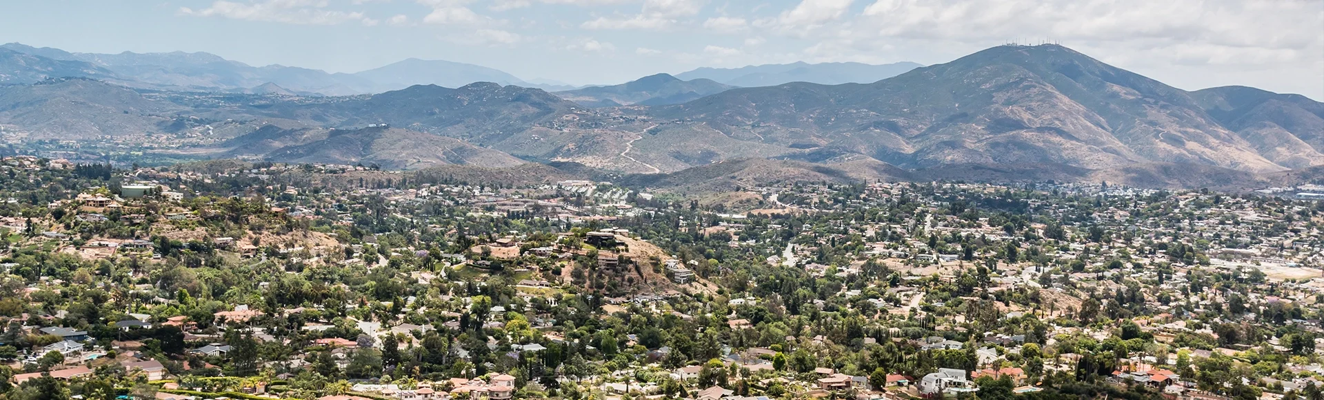 View of mountains and city from Mt. Helix Park in La Mesa, a city in San Diego, California.