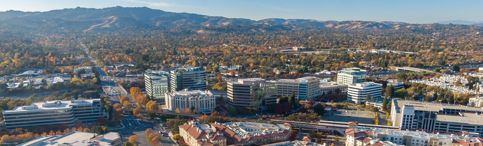 
Aerial view of Pleasanton, California, USA, showcasing the city's urban landscape, architecture, and transportation infrastructure during the autumn season.