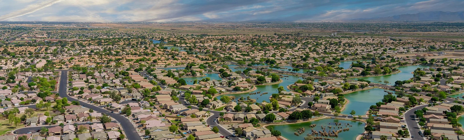 Landscape scenic aerial panorama view of a suburban settlement in USA with detached houses with Avondale Arizona