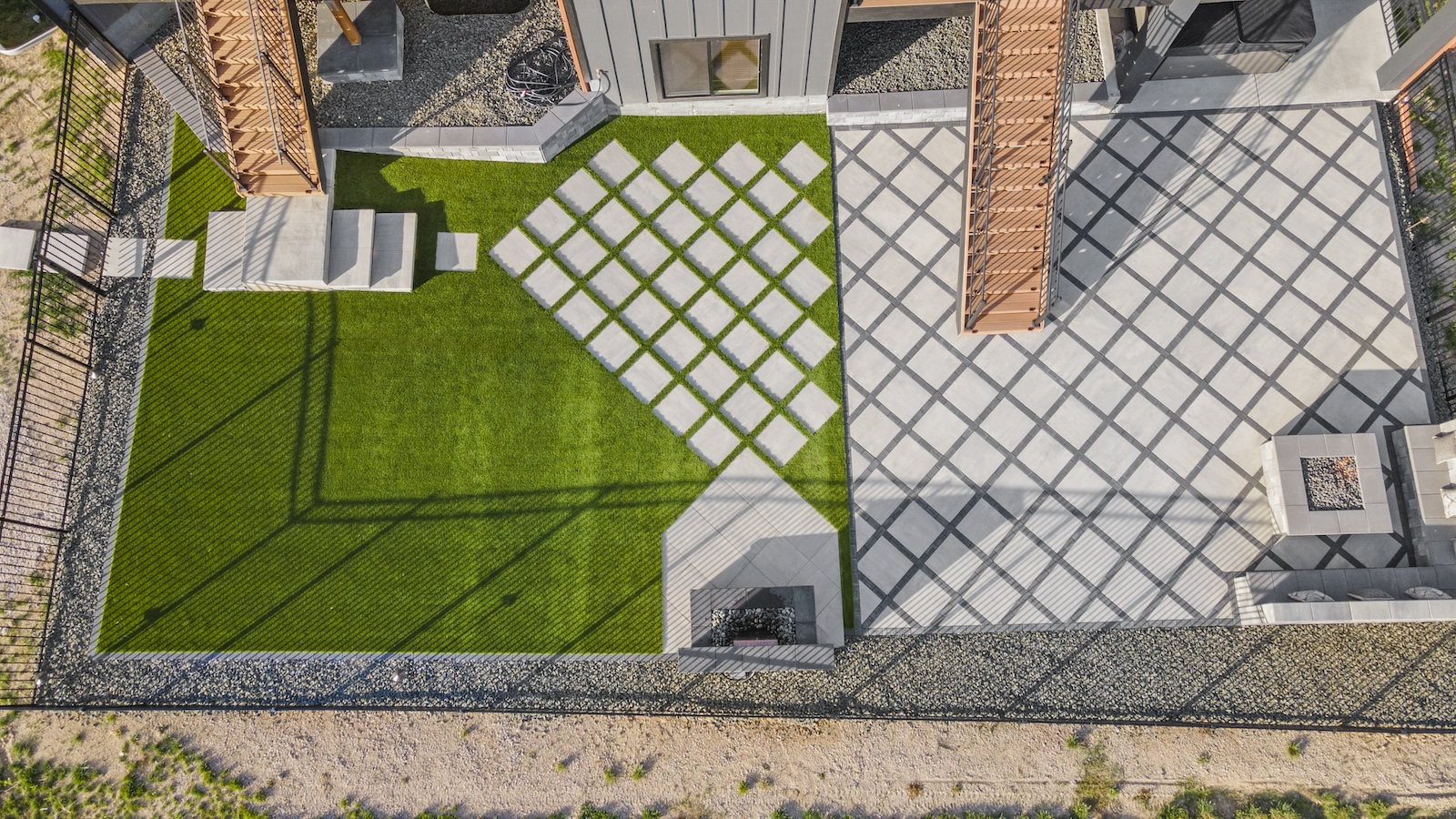 Ariel view of permeable paver backyard remodel in Denver Colorado with firepit and decking