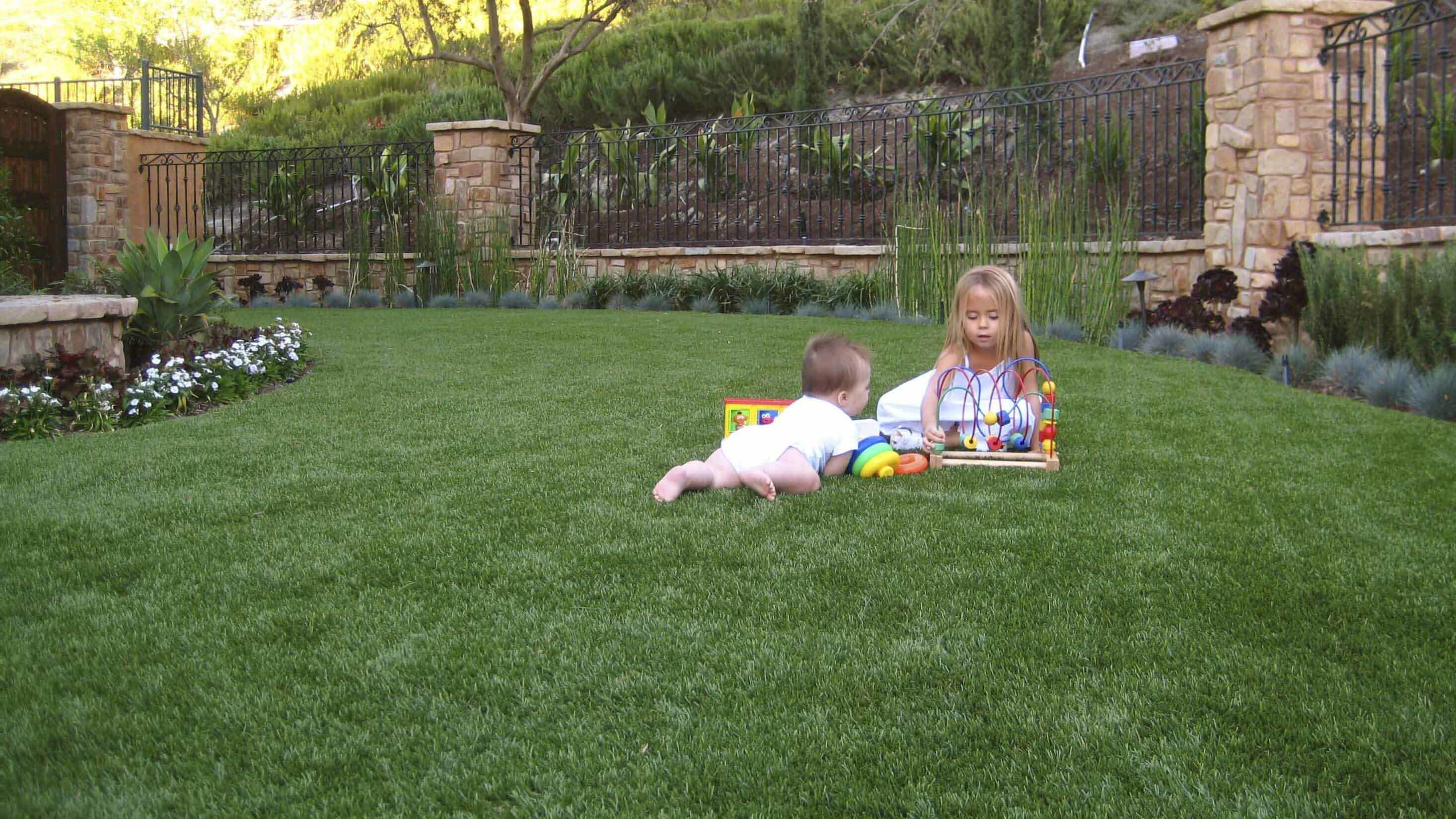 kids in turf backyard