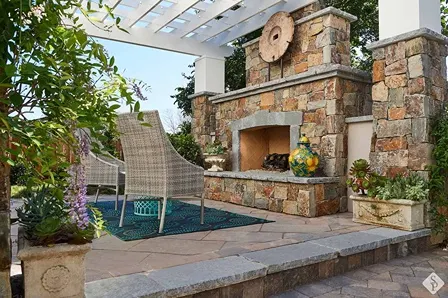 outdoor fireplace and pergola