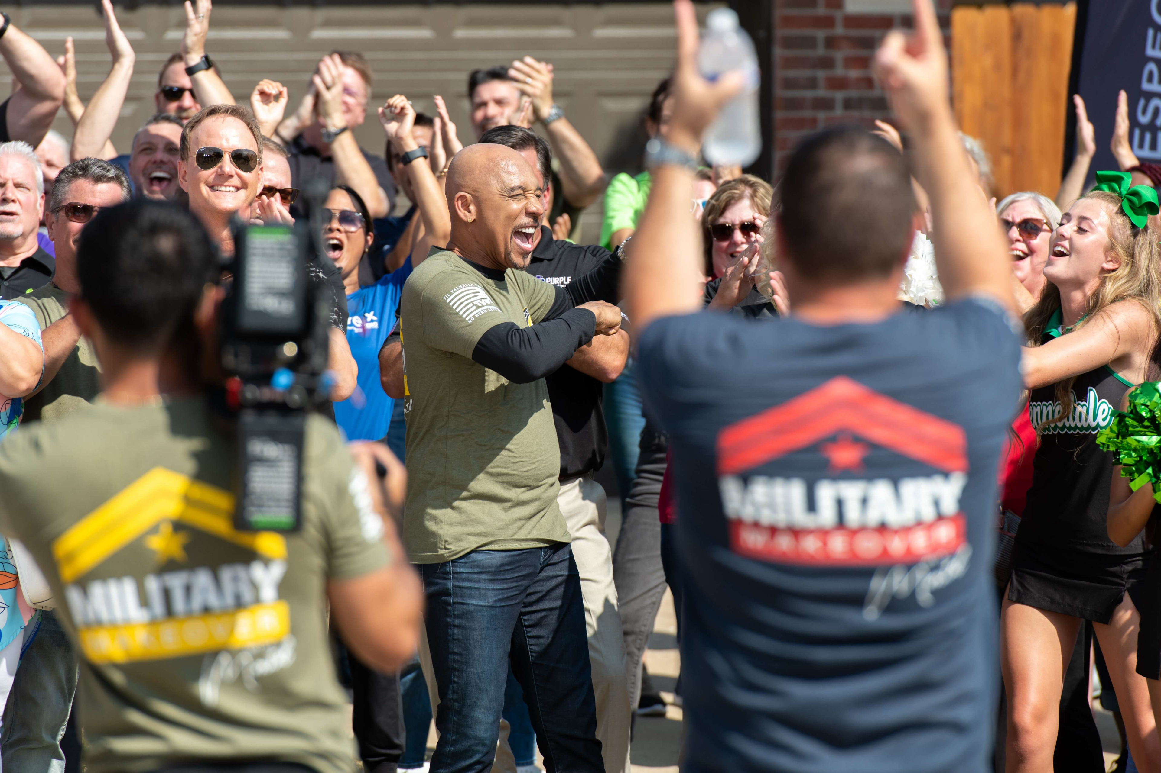 Lifetime Network Military Makeover with Montel Williams Behind the Scenes Crowd Cheering Montel Host US Veteran Carlos Colon Ruiz