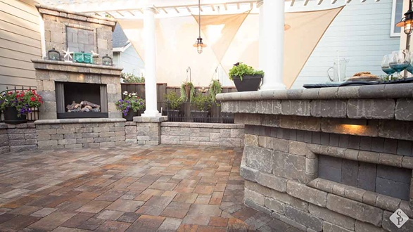 paver patio with outdoor fireplace