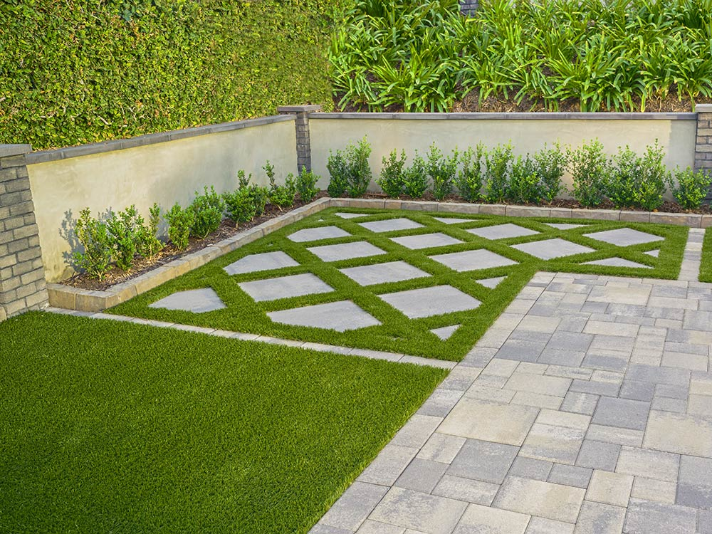 Artificial turf with stone pavers