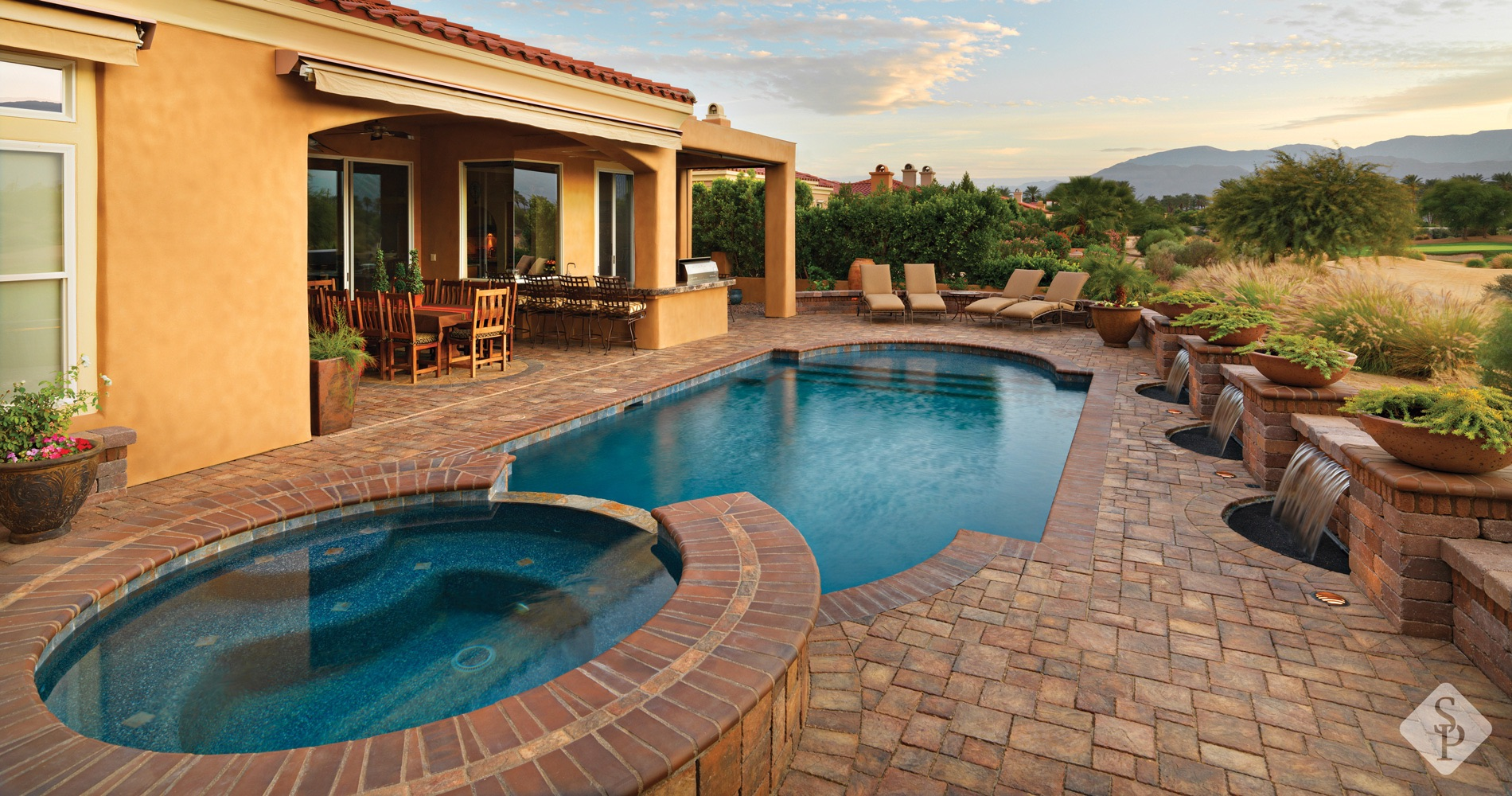 hot tub and pool with pool deck pavers