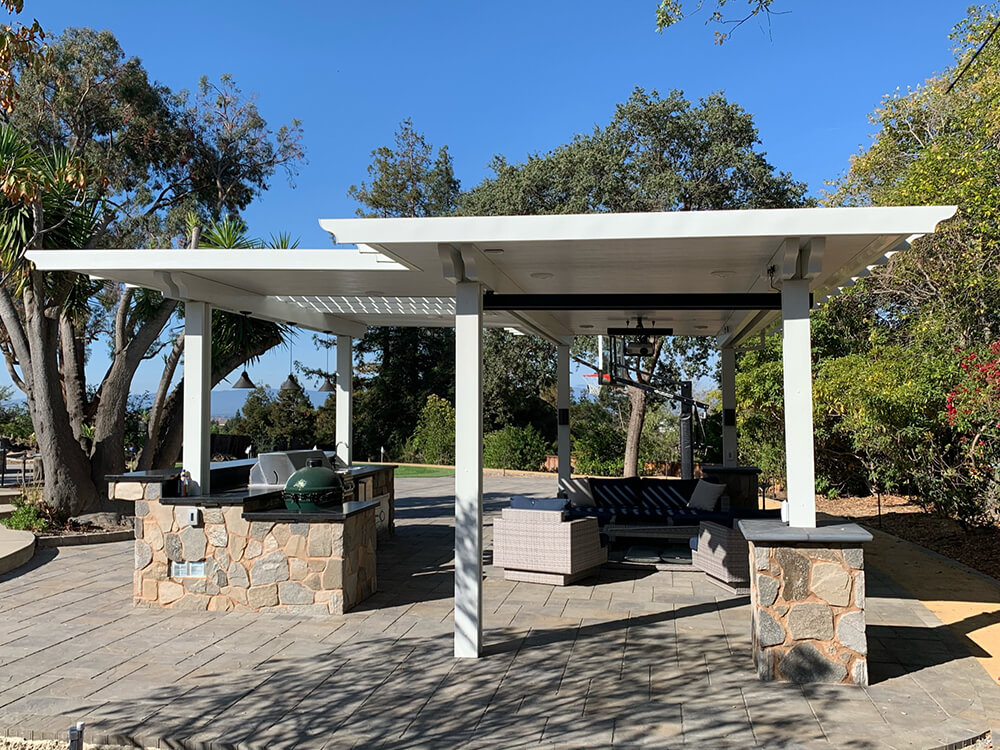 Outdoor kitchen with a grilled station and pergola