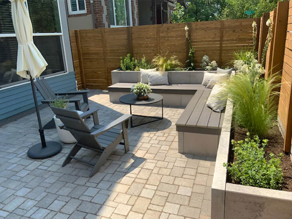 Modern small paver patio with raised planters and bench in Denver, Colorado