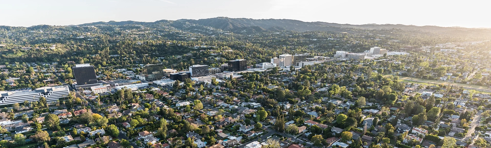 Late afternoon aerial view of Sherman Oaks and Encino in the San Fernando Valley area of Los Angeles, California.