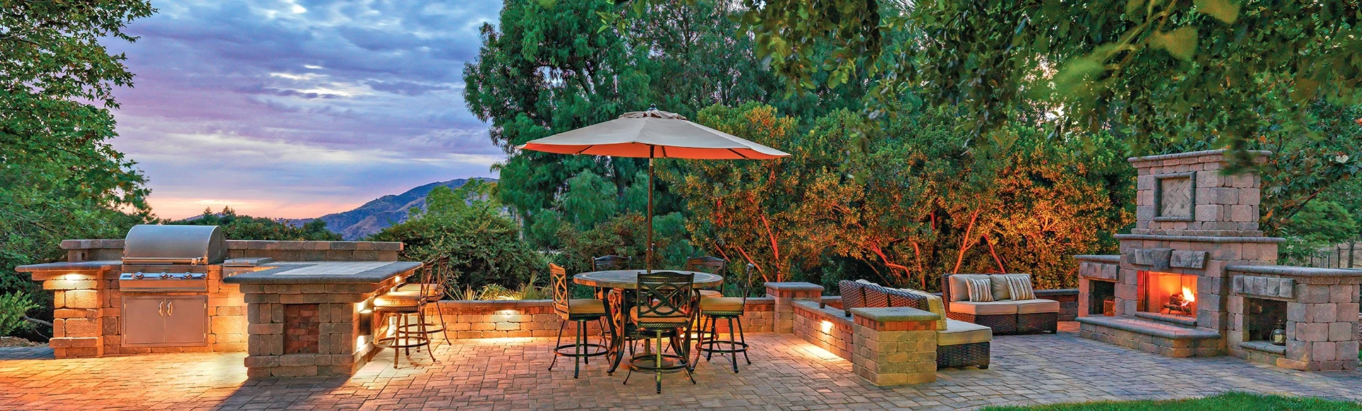 Large patio with outdoor kitchen and fire place. 