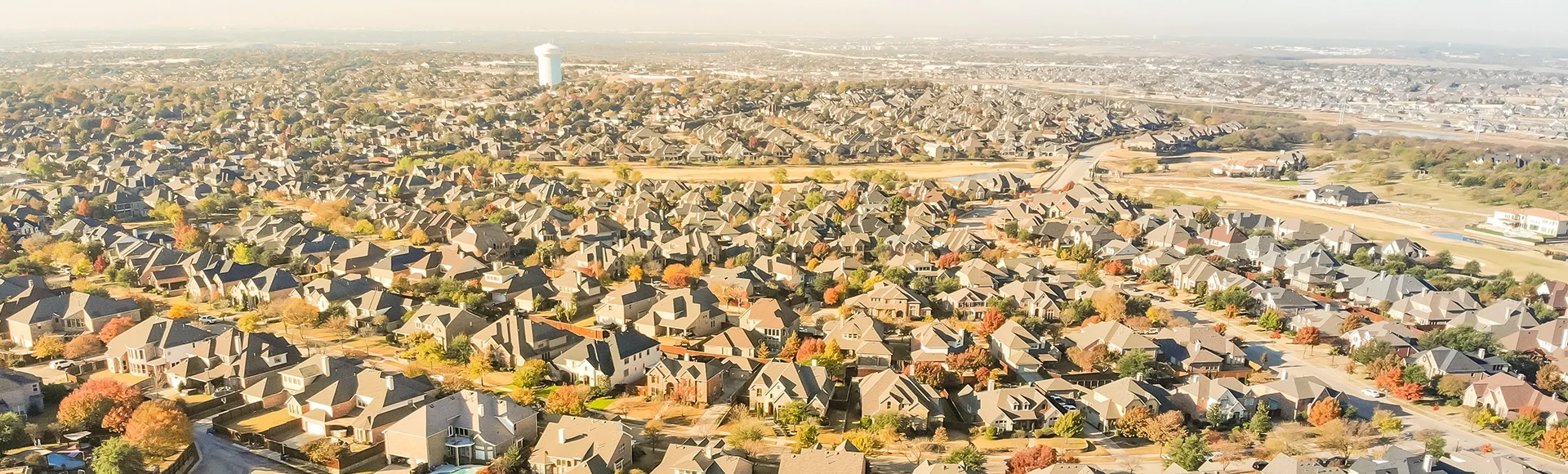 Aerial view new development neighborhood in Cedar Hill, Texas, USA in morning fall with colorful leaves. A city in Dallas and Ellis counties located approximately 16 miles southwest of downtown Dallas