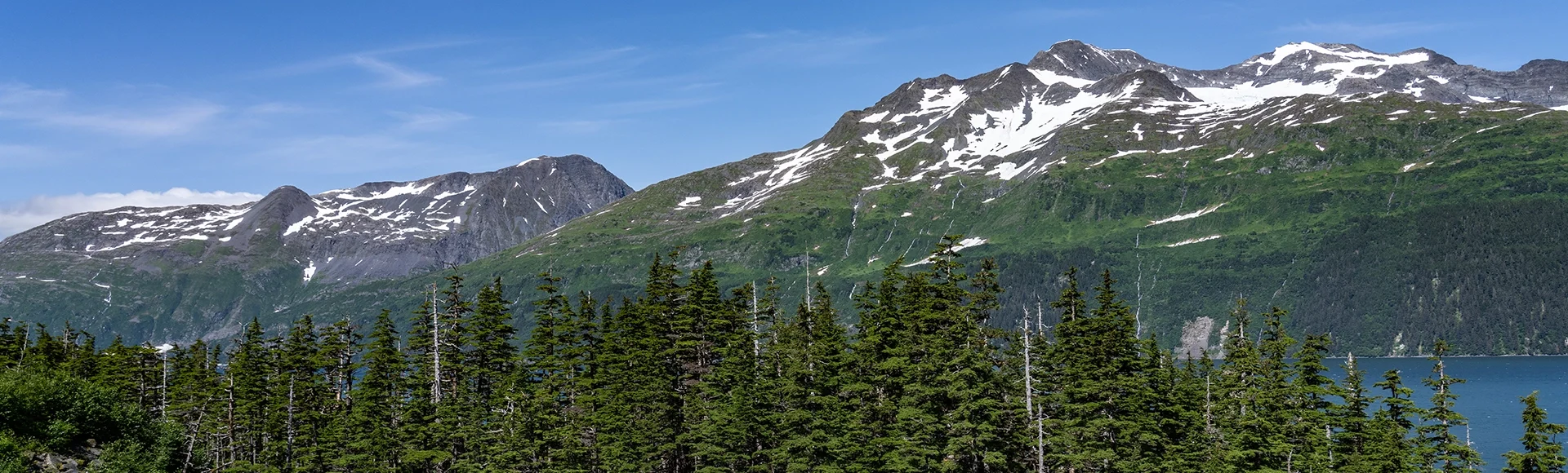 Glacier water falls. Shotgun Cove Trail, Whittier is a city at the head of the Passage Canal in the Chugach Census Area in Alaska.
