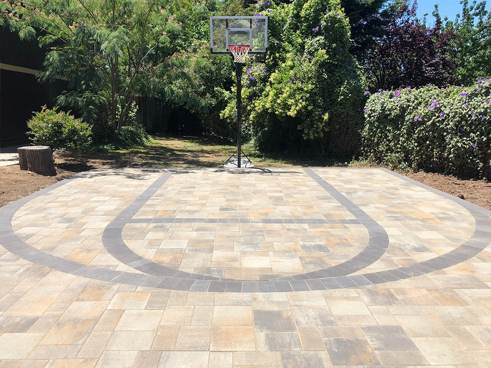 Driveway basketball court made of paving stones in midtown