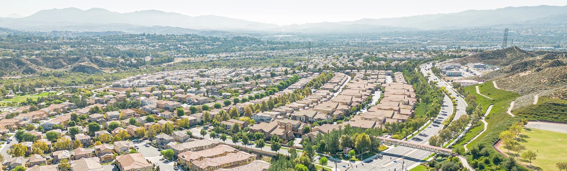 Valencia, California - aerial drone photo view toward West Creek Townhouse in Valencia with new townhouse homes and West Creek Park
